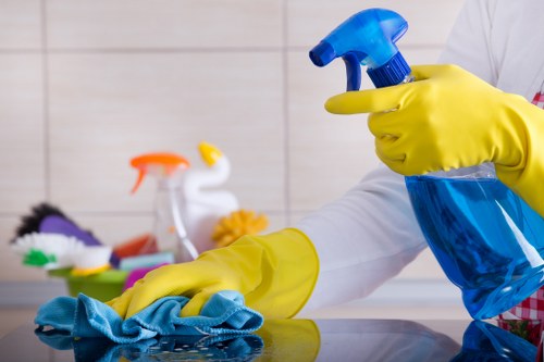 Kitchen surfaces being cleaned as part of domestic cleaning in Finchley
