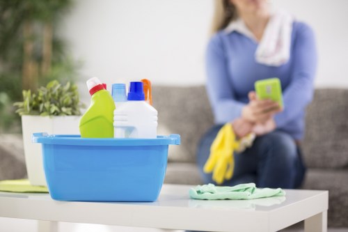Commercial office cleaning team in Finchley sanitising workstations